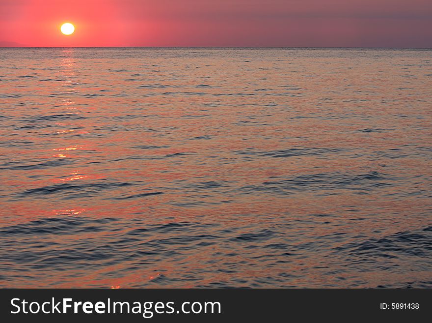 Details of ocean and sunrise in Greece