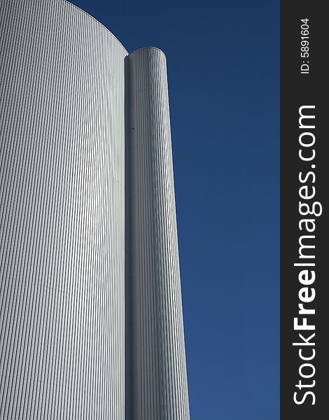 Close-up on a silo against the blue sky. Copy space