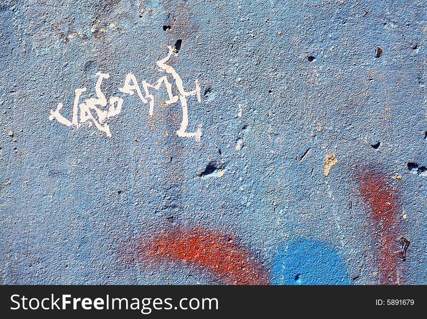 Graffiti on a wall ideal for urban or grunge background. Graffiti on a wall ideal for urban or grunge background