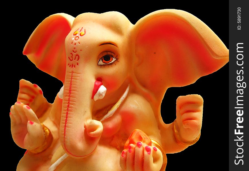 A beautifully carved idol of Lord Ganesha with huge ears, of the Hindu religion