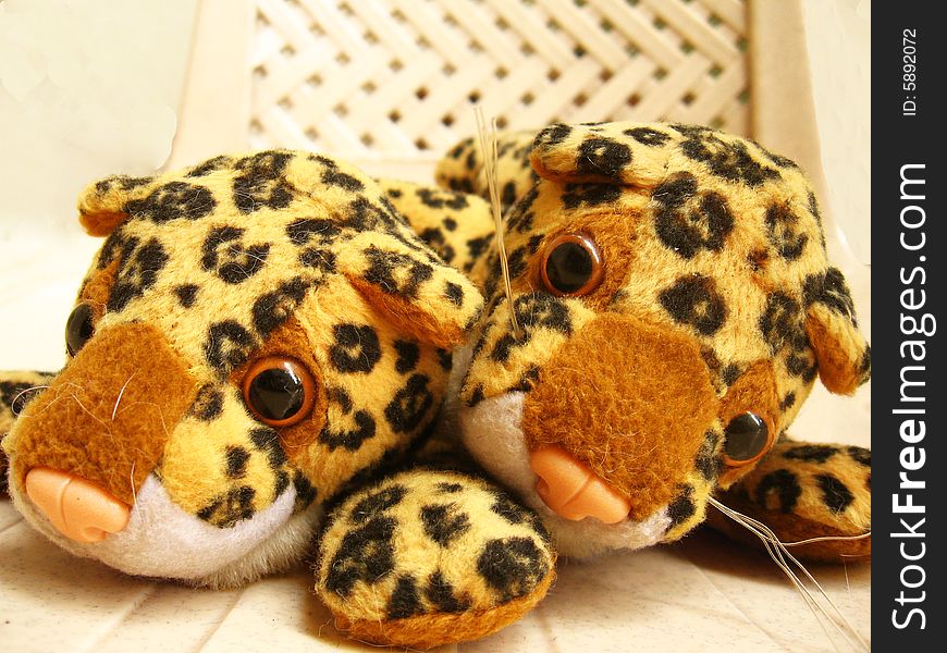 A couple of tiny cheetah soft toys