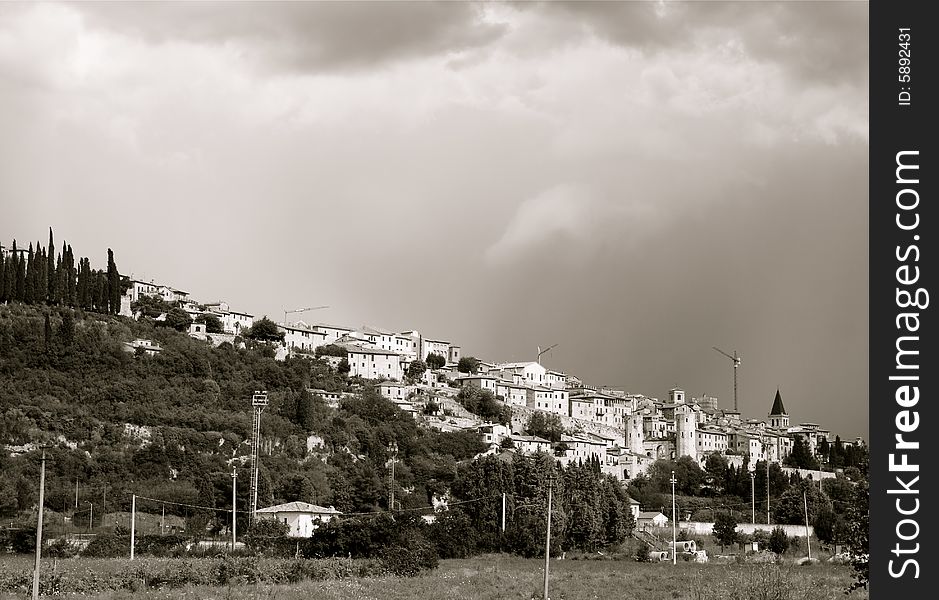 Photo of Spello with the clouds
