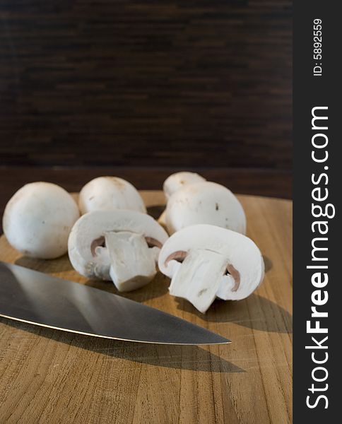 Some fresh mushrooms on a wooden board