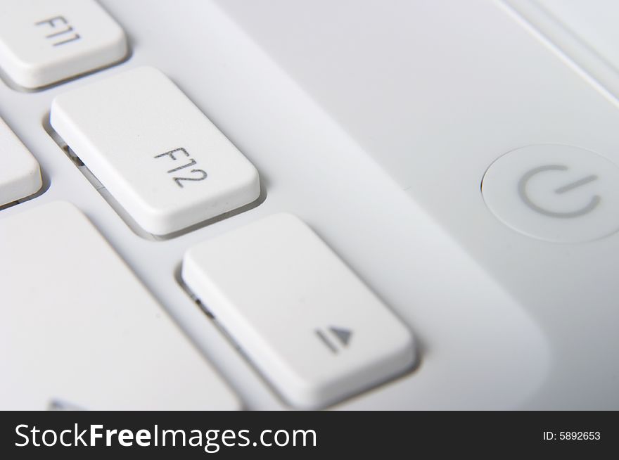 White laptop - Closeup of white keyboard. White laptop - Closeup of white keyboard