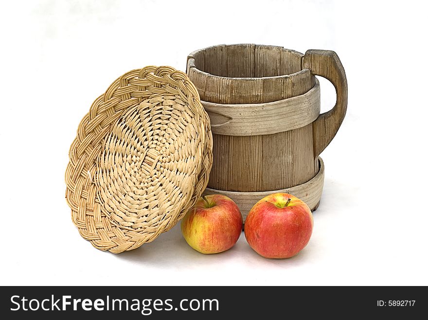 Hand-made wooden crockery and two rad apples. Hand-made wooden crockery and two rad apples