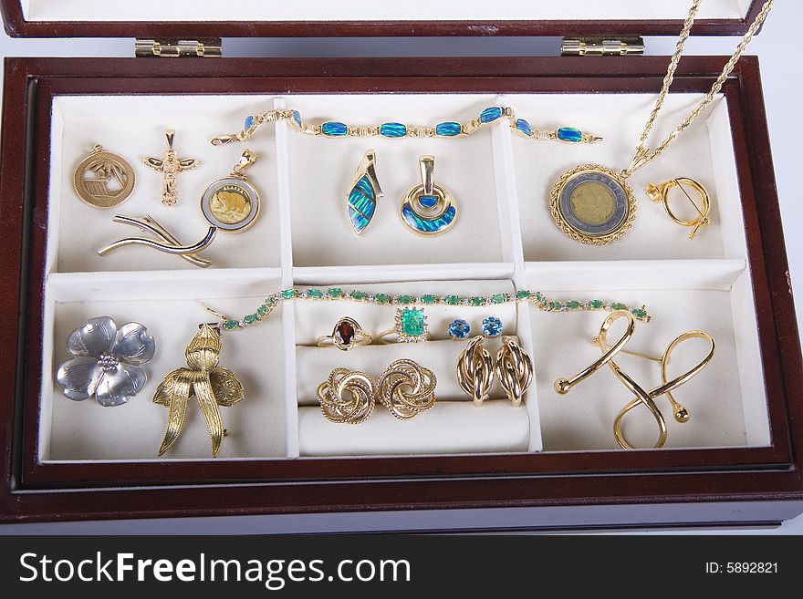 Many nice pieces of jewelry in a lined box. Many nice pieces of jewelry in a lined box