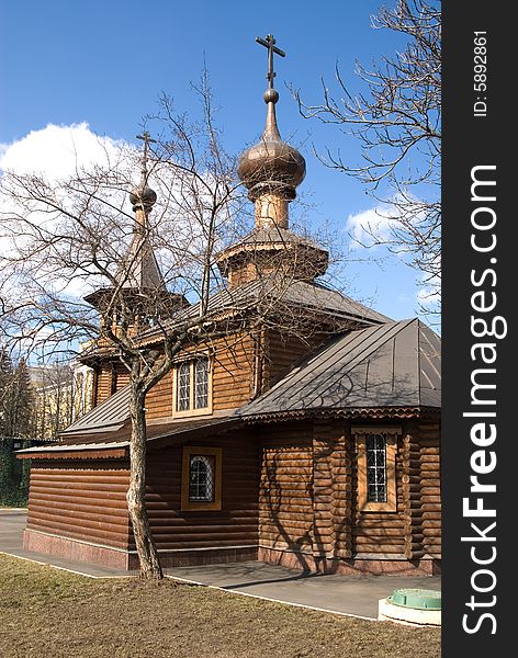 Russian orthodox wooden church in sunny spring day