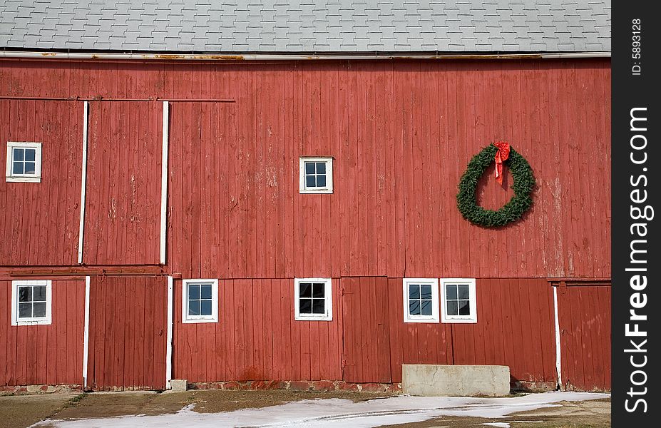 Red barn side detail with holiday wreath