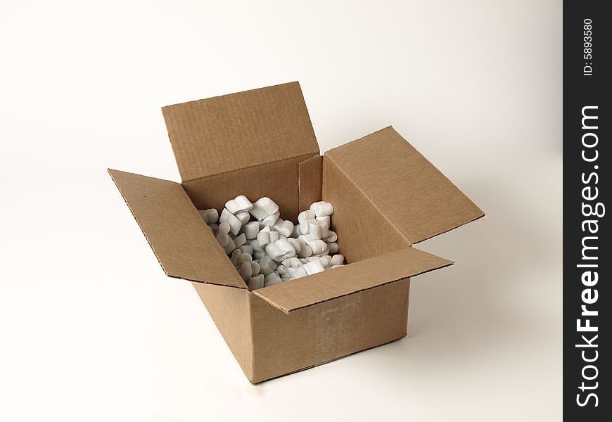 A moving box filled with packing peanuts. A moving box filled with packing peanuts.