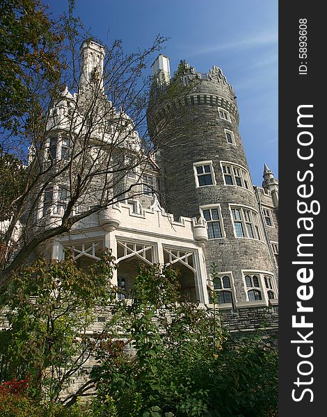 A view of the rear of Casa Loma in Toronto, Ontario as seen from the formal gardens