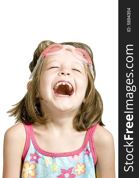 Little girl with goggles and missing teeth laughing. Little girl with goggles and missing teeth laughing