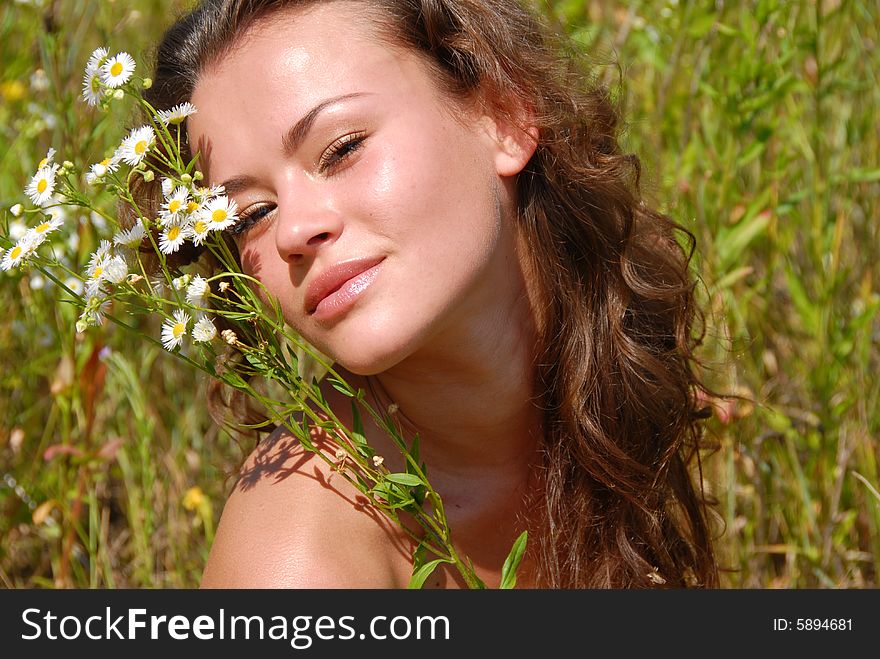 Portrait of the beautiful girl with flowers. Portrait of the beautiful girl with flowers