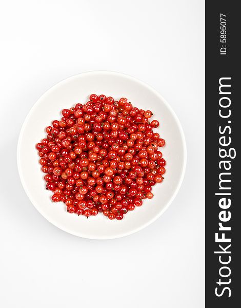 Redcurrant berries in a white bowl. Redcurrant berries in a white bowl