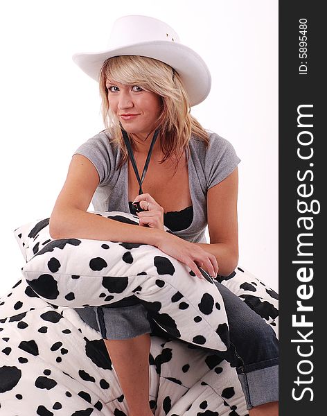 Studio shot of blond hair girl with white cowboy hat. Studio shot of blond hair girl with white cowboy hat.
