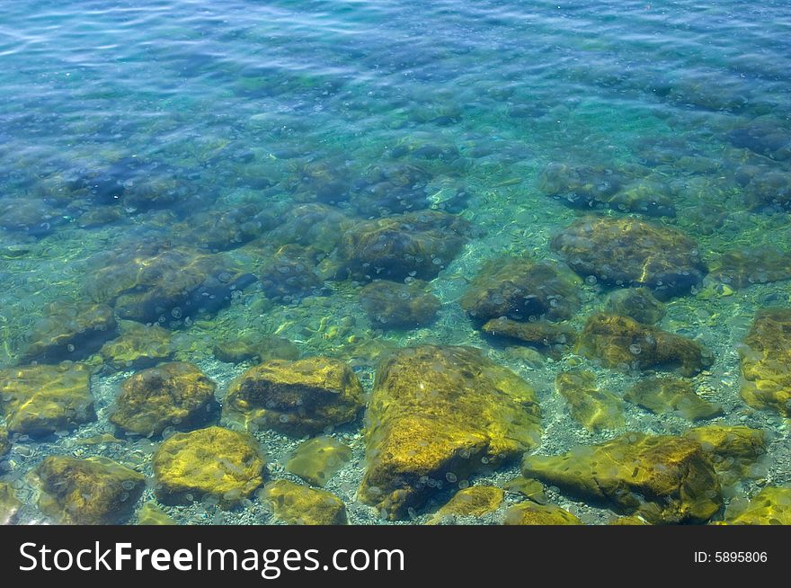 Stones in a transparent sea