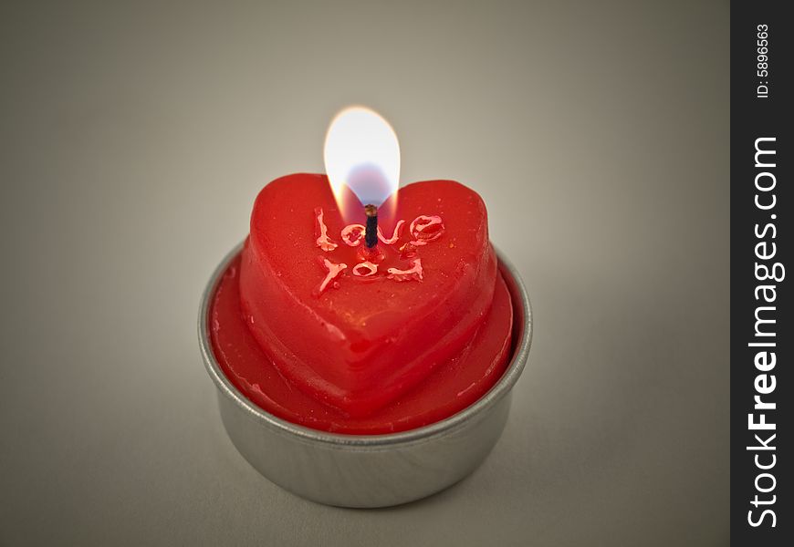 Red candle with an inscription, isolated. Red candle with an inscription, isolated