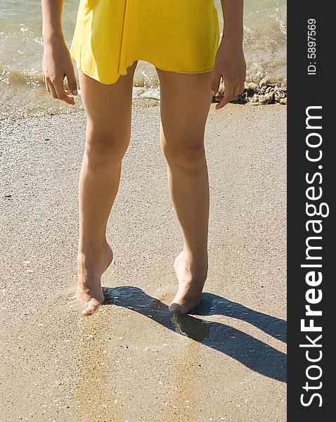 Legs on sand background for your design