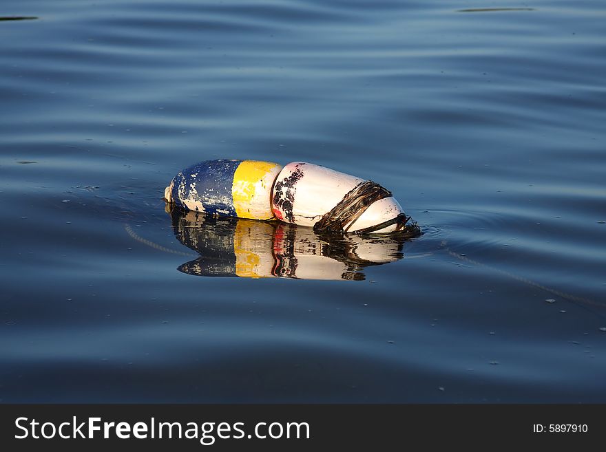 Crab or lobster buoy floating.