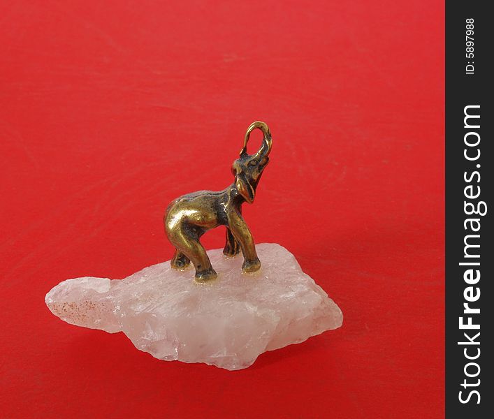 Golden elephant on white crystal