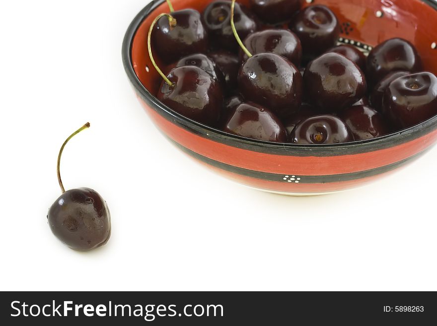 A bowl of cherries isolated on white background