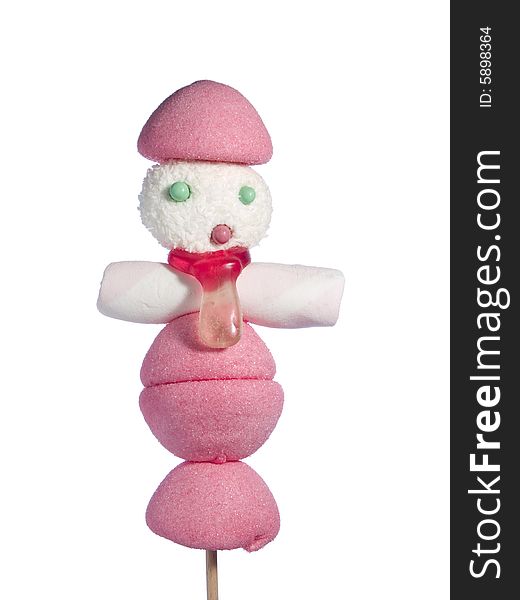 A male figurine made out of candies on a stick over a white background. A male figurine made out of candies on a stick over a white background.