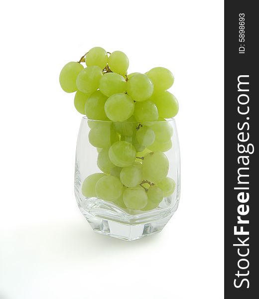 Juicy cluster Grapes in grass, isolated, white background