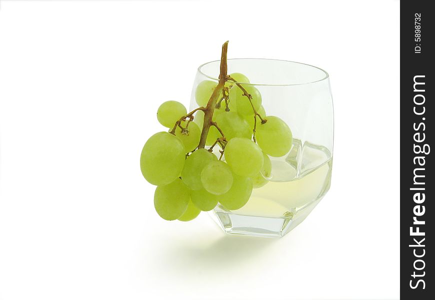 Juicy cluster Grapes in grass, isolated, white background