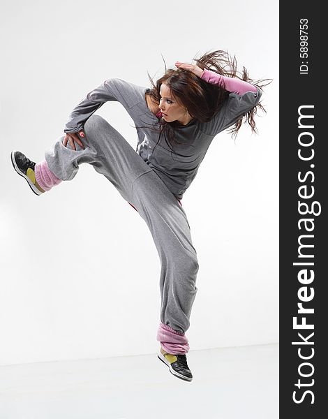 Cool looking dancer posing on a white background. Cool looking dancer posing on a white background