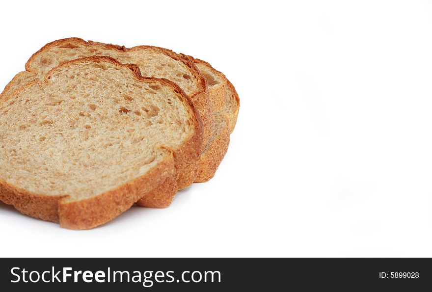 Three slices of wheat bread isolated on white background. Three slices of wheat bread isolated on white background.