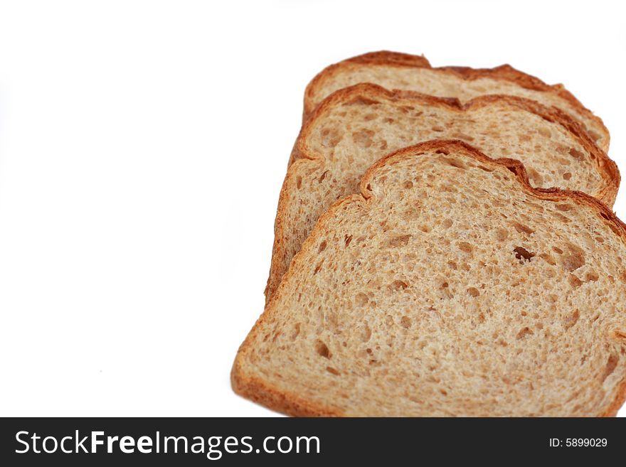 Three slices of wheat bread isolated on white background. Three slices of wheat bread isolated on white background.