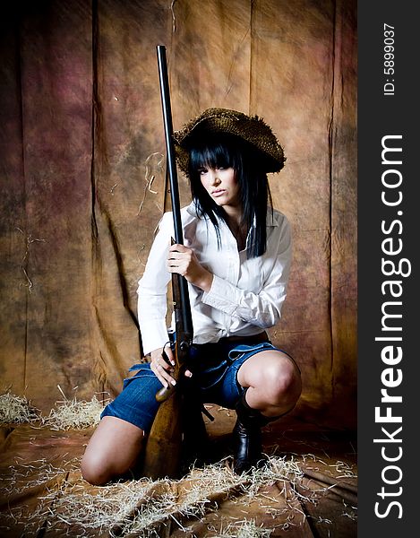 Farmer girl with shotgun