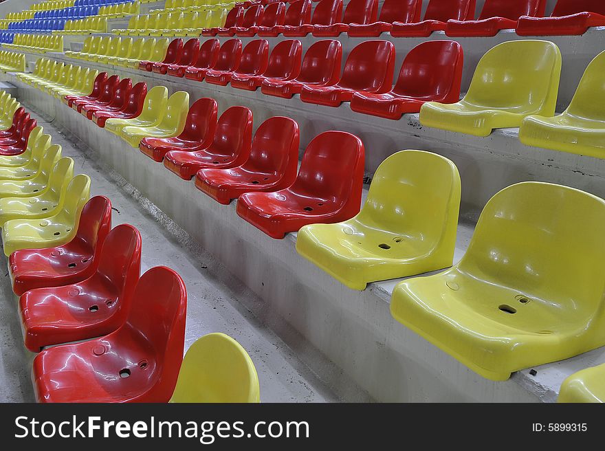 Rows of newly built stadium chairs.