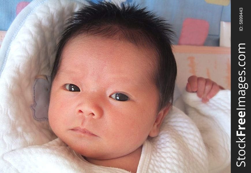 Lovely infant on a bed