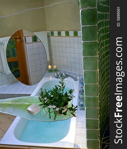 Big bathroom with green mosaic