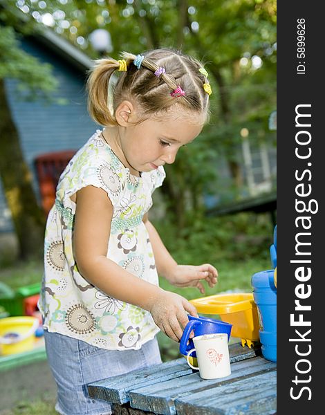 Playing little girl playing outdoor