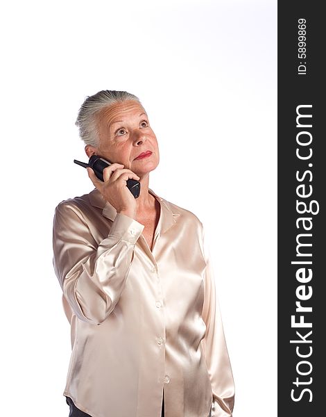 Portrait of senior female executive against white background