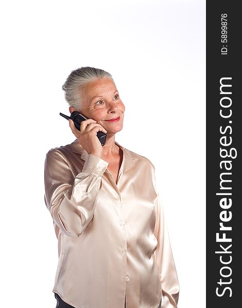 Portrait of senior female executive against white background