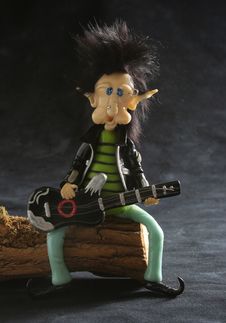 Rocker Dwarf Playing The Guitar Royalty Free Stock Images