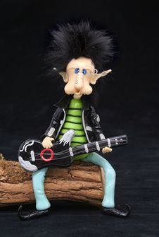 Rocker Dwarf Playing The Guitar Stock Photo