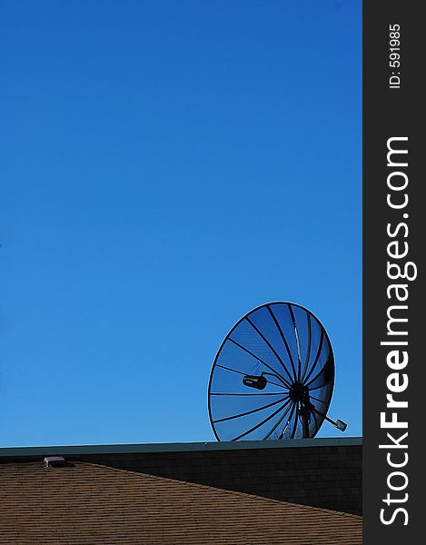 Full size satellite dish on roof. Full size satellite dish on roof.