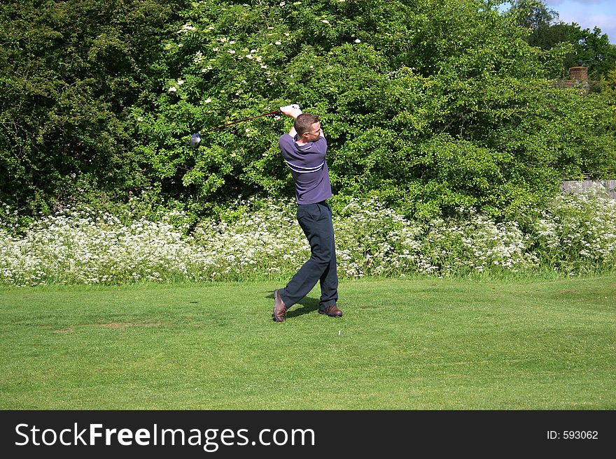 A junior golf champion practices. A junior golf champion practices