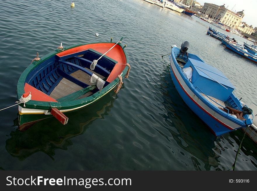 Two coloured fishing boats in the harbour