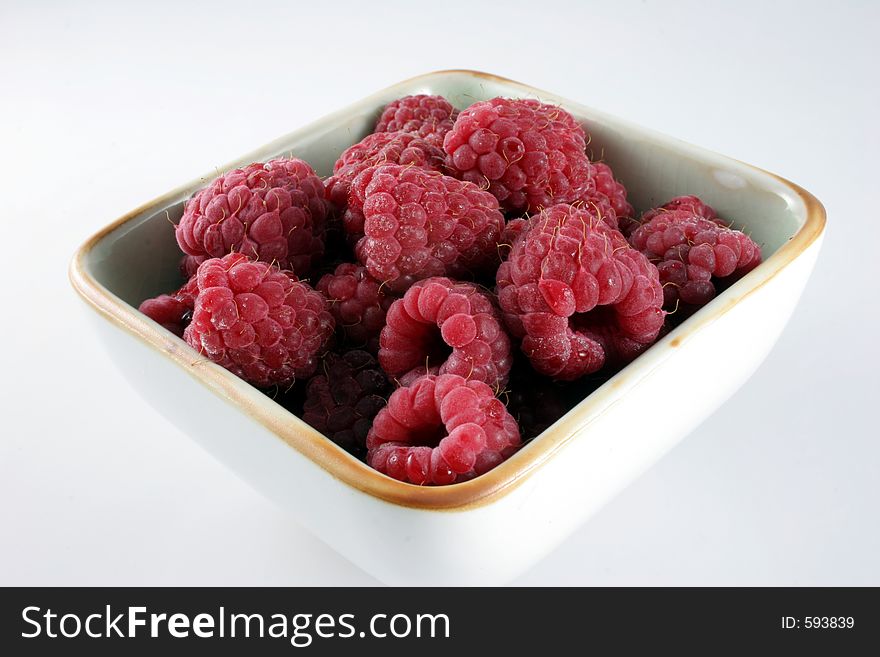 Square bowl of raspberries