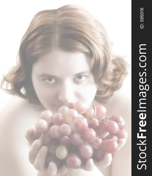 Girl with bunch of grapes