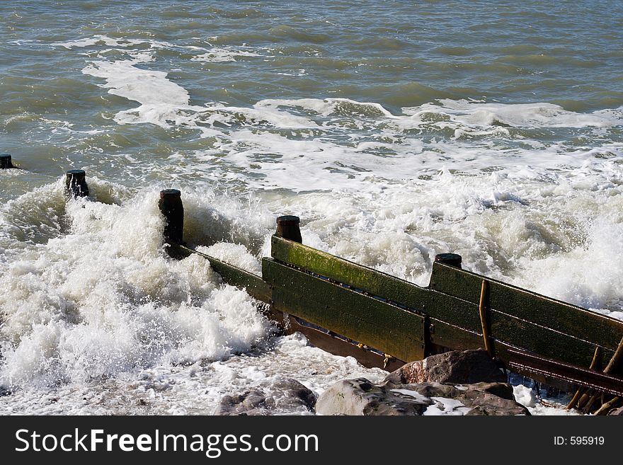 Wooden sea defence on an English beach. Wooden sea defence on an English beach.