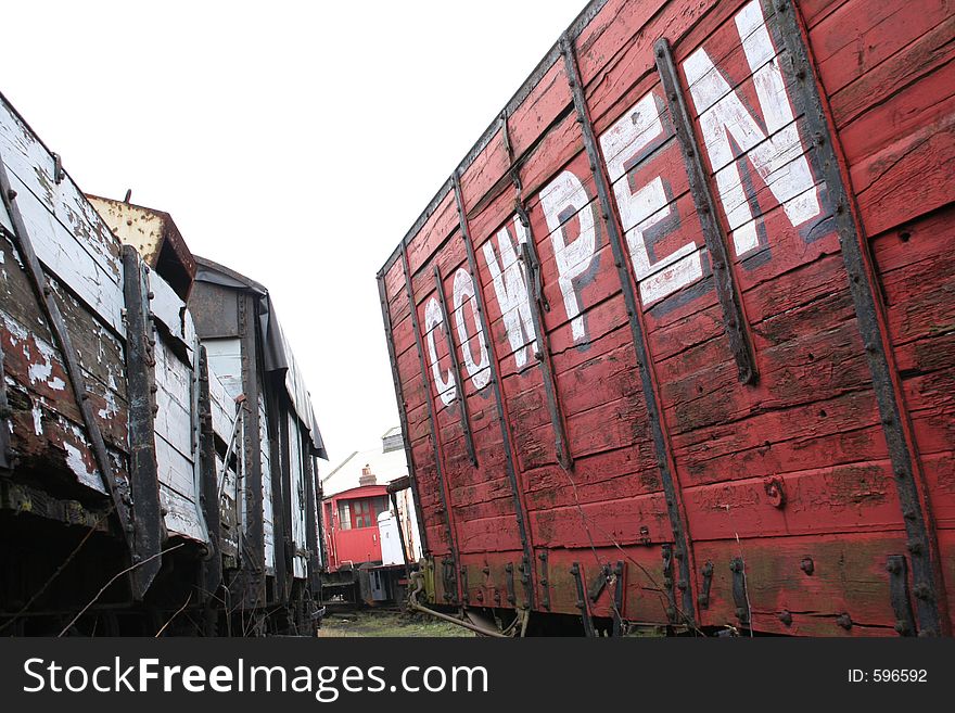 A train carriage with the words cow pen on the side. A train carriage with the words cow pen on the side