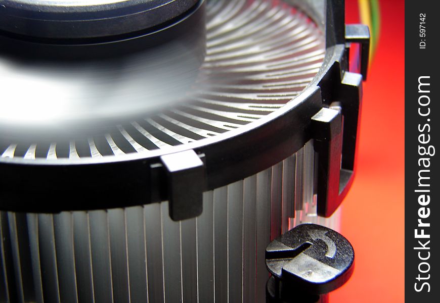 PC cooling fan close up macro. Fan is spining so wings are blurry. PC cooling fan close up macro. Fan is spining so wings are blurry.