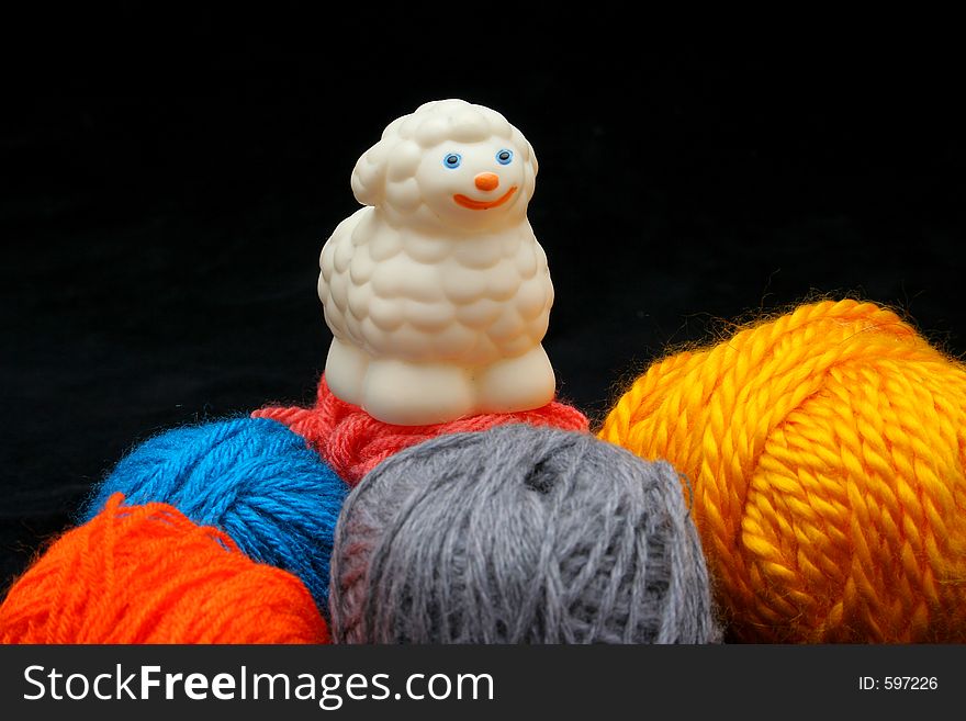 Sheep Over Balls Of Yarn