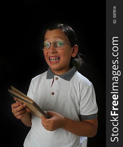 Happy student boy with glasses and a book