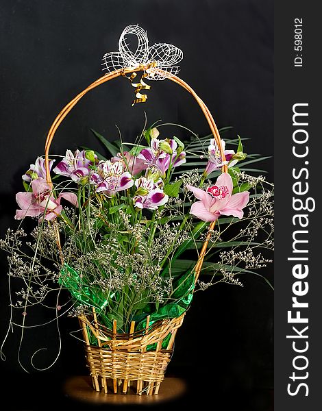 Celebratory bouquet of orchids on a black background